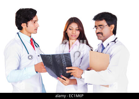 three indian Doctor Discuss X-Ray Report Stock Photo