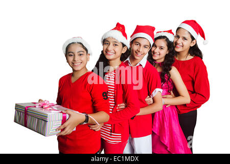 indian friends group Christmas Festival showing gift Stock Photo