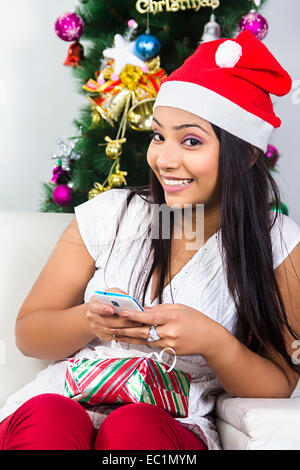 one indian lady Christmas Festival chatting phone Stock Photo