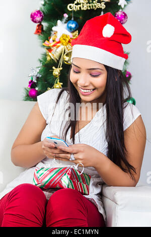 one indian lady Christmas Festival chatting phone Stock Photo