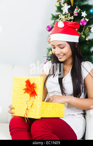 one indian lady Christmas Festival surprise gift Stock Photo