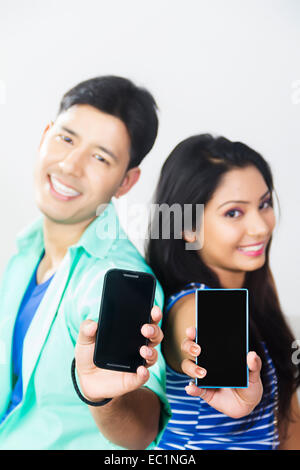indian college couple showing phone Stock Photo
