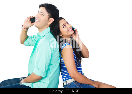 indian college couple talking phone Stock Photo