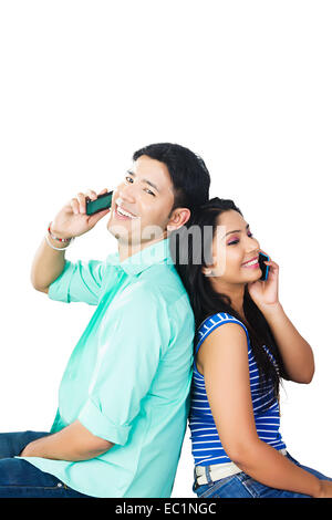 indian college couple talking phone Stock Photo