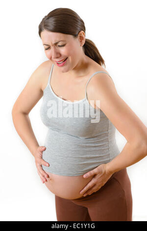 Pregnant woman in pain isolated on white Stock Photo