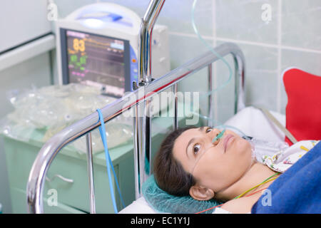 Woman being monitored in a recovery room Stock Photo