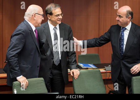 French Foreign Minister Michel Sapin (L) , Greek Finance Minister Gikas Chardouvelis and Spanish Economy Minister Luis de Guindos   at EU council headquarters in Brussels, Belgium on 08.12.2014 On the agenda of the session is assessment of the euro area member states‘ draft budgetary plans. The economy and finance ministers of the Eurozone will discuss also Greece (fifth review and follow up arrangements), Portugal (first post-programme surveillance report), Ireland (second post-programme surveillance mission), Stimulating investments and structural reforms. by Wiktor Dabkowski Stock Photo