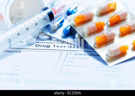 Syringe with glass vials and medications pills drug on white Stock Photo