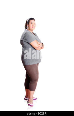 Full-size view of fit woman standing in the yoga studio. Fitness