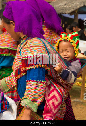 A flower hmong and her baby at Bac Ha Week end market Stock Photo