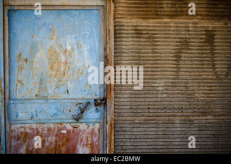 Rusty door texture of an old garage door and wall Stock Photo