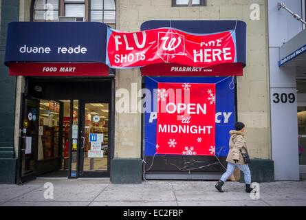A sign outside a Duane Reade/Walgreens drugstore in New York on Friday, December 5, 2014 advertises that flu shots are available. The Centers for Disease Control announced that this years H3N2 has mutated and this year's vaccine will not be as effective as hoped. The CDC is still encouraging the public to get a shot as the vaccine, which covers three strains, is still effective against the non-mutated H3N2. (© Richard B. Levine)