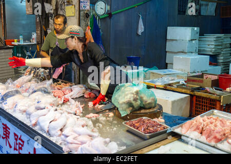 NEW TAIPEI CITY, TAIPEI, TAIWAN. NOVEMBER 2, 2014. Traditional street market in Taiwan with vendors selling meat. Stock Photo