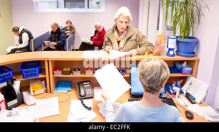 An NHS waiting room and reception desk Stock Photo