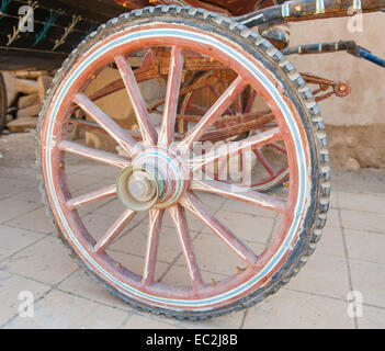 detail of horse carriage wheel on street in city town rome Stock Photo