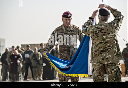 US Army Lt. Gen. Joseph Anderson, Commander, ISAF Joint Command and Royal Army Maj. Gen. Richard Nugee, ISAF Chief of Staff, lower the ISAF Joint Command colors as NATO formally ended combat operations in Afghanistan 13-years after invading to end the Taliban rule during a ceremony December 8, 2014 in Kabul, Afghanistan. Stock Photo