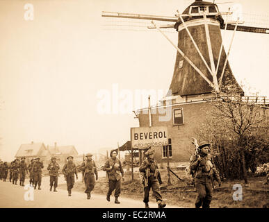 Infantry of the Regiment de Maisonneuve moving through Holten to Rijssen, both towns in the Netherlands.  9 April 1945.  Lt. D. Guravitch.  Canadian Military photograph.  New York Times Paris Bureau Collection.  (USIA) Stock Photo