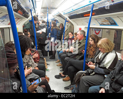 Busy Victoria Tube line metro train, on London Underground, capital city centre, Greater London, England, UK Stock Photo