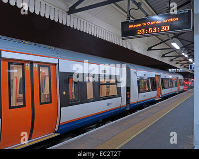 Alone on an Overground platform - Welcome to Clapham Junction railway station, at night, London's busiest, England, UK Stock Photo