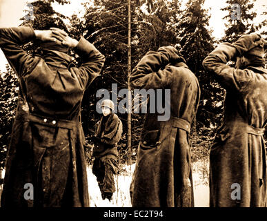 'We were getting our second wind now and started flattening out that bulge.  We took 50,000 prisoners in December alone,' Ca.  1944. Army. Stock Photo