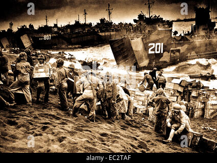Out of the gaping mouths of Coast Guard and Navy Landing Craft, rose the great flow of invasion supplies to the blackened sands of Iwo Jima, a few hours after the Marines had wrested their foothold on the vital island.  1945. Stock Photo