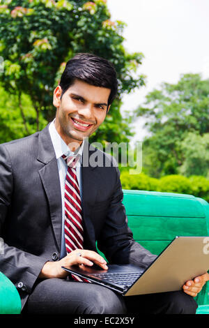 indian Business Man park laptop working Stock Photo