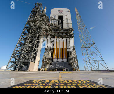 NASA’s Orion spacecraft mounted atop a United Launch Alliance Delta IV Heavy rocket is visible inside the Mobile Service Tower where the vehicle is undergoing launch preparations, Wednesday, Dec. 3, 2014, Cape Canaveral Air Force Station's Space Launch Complex 37, Florida. Orion is NASA’s new spacecraft built to carry humans, designed to allow us to journey to destinations never before visited by humans, including an asteroid and Mars. Stock Photo