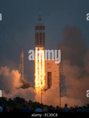 The United Launch Alliance Delta IV Heavy rocket with NASA’s Orion spacecraft mounted atop, lifts off from Cape Canaveral Air Force Station's Space Launch Complex 37 at at 7:05 a.m. EST, Friday, Dec. 5, 2014, in Florida. The Orion spacecraft will orbit Earth twice, reaching an altitude of approximately 3,600 miles above Earth before landing in the Pacific Ocean. No one is aboard Orion for this flight test, but the spacecraft is designed to allow us to journey to destinations never before visited by humans, including an asteroid and Mars. Stock Photo