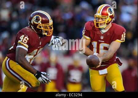 DEC 07, 2014 : Washington Redskins quarterback Colt McCoy (16) hands the ball off to Washington Redskins running back Alfred Morris (46) during the matchup between the St. Louis Rams and the Washington Redskins at FedEx Field in Landover, MD. Stock Photo