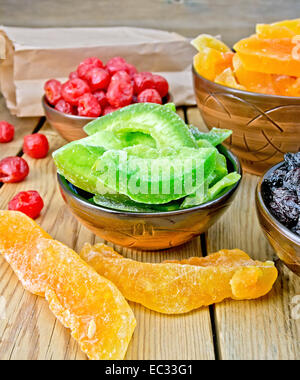 Candied pomelo and fruit in bowl on board Stock Photo