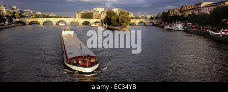 France, Paris, Barge on the River Seine bellow the Pont Neuf and Ile de la Cite, Stock Photo