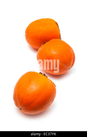 Persimon or Sharon fruit isolated on a white studio background. Stock Photo