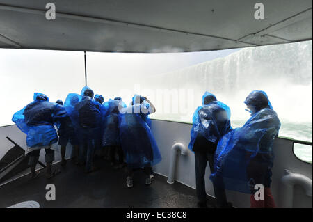 Tourists in raincoats on the tour boat Maid of the Mist, Horseshoe Falls, Niagara Falls, Niagara Falls, Ontario Province, Canada Stock Photo