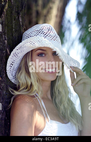 yong woman with summer hat Stock Photo