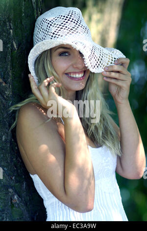 young woman with a summer hat Stock Photo