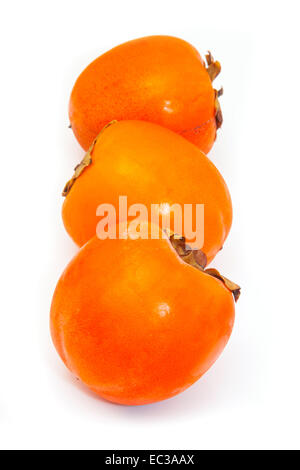 Persimon or Sharon fruit isolated on a white studio background. Stock Photo