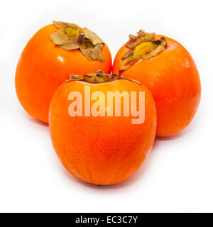 Persimon or Sharon fruit isolated on a white studio background. Stock Photo