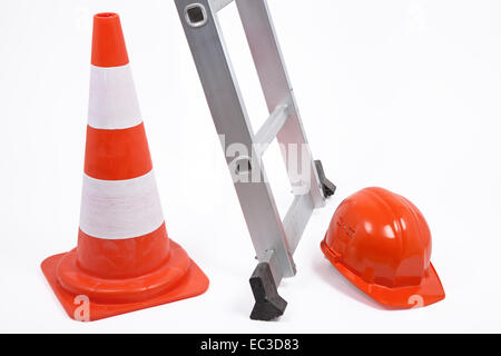 Traffic cone, ladder and hardhat Stock Photo