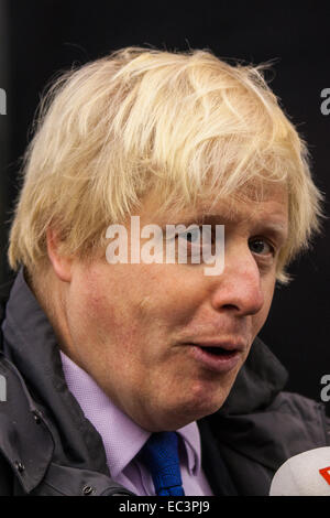 Ealing, London, UK. 9th December 2014. Mayor of London Boris Johnson visits Ealing accompanied by Met Police Commissioner Sir Bernard Hogan-Howe hold a walkabout in Ealing to announce details of the historic deal secured for the New Scotland Yard site in Victoria. Credit:  Paul Davey/Alamy Live News Stock Photo