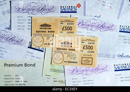 A variety of styles of Premium Savings Bond certificates from 1970s to 2004. Stock Photo