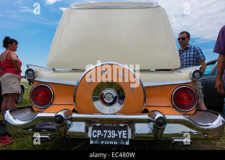 Ford Galaxie Skyliner in orange and cream shot at the Locomotion Day in Francueil village, France. Stock Photo