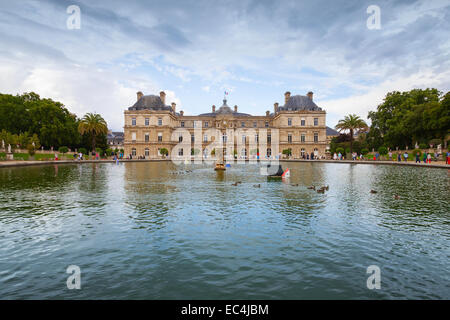 Paris, France - August 10, 2014: Luxembourg Palace and reflection in the pond with fountain. Luxembourg Garden in Paris Stock Photo