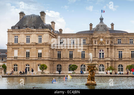 Paris, France - August 10, 2014: Luxembourg Palace and pond with the fountain. Luxembourg Garden in Paris Stock Photo