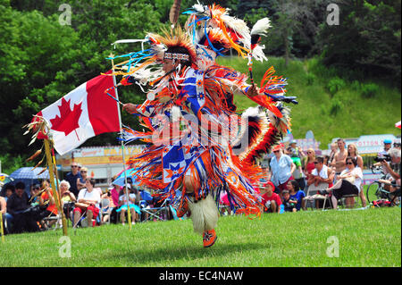 Indigenous Canadians dance during Canada Day celebrations held in a park in London, Ontario. Stock Photo