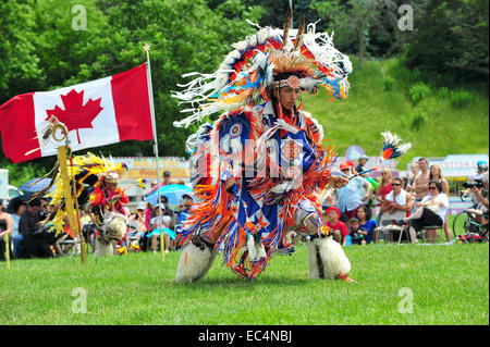 Indigenous Canadians dance during Canada Day celebrations held in a park in London, Ontario. Stock Photo