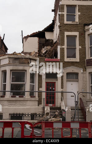 Blackpool,UK. 9th December 2014, With the demolition of Tyldesley road continuing some of the residents still occupy their homes whilst the destruction carries on around them. The regeneration and building of new homes is well underway Credit:  Gary Telford/Alamy live news Stock Photo