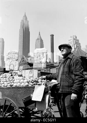 Push cart fruit vendor at the Fulton Fish Market - New York, New York. Circa 1943. Photograph by Gordon Parks/FSA Stock Photo