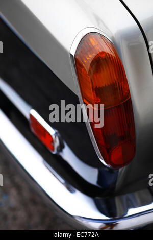 Detail on the rear light of a vintage car. Stock Photo
