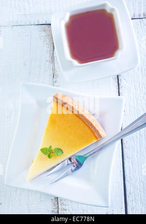 sweet cheesecake on plate and tea in cup Stock Photo