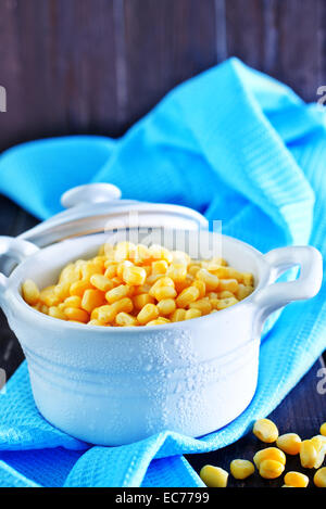 sweet corn in bowl and on a table Stock Photo